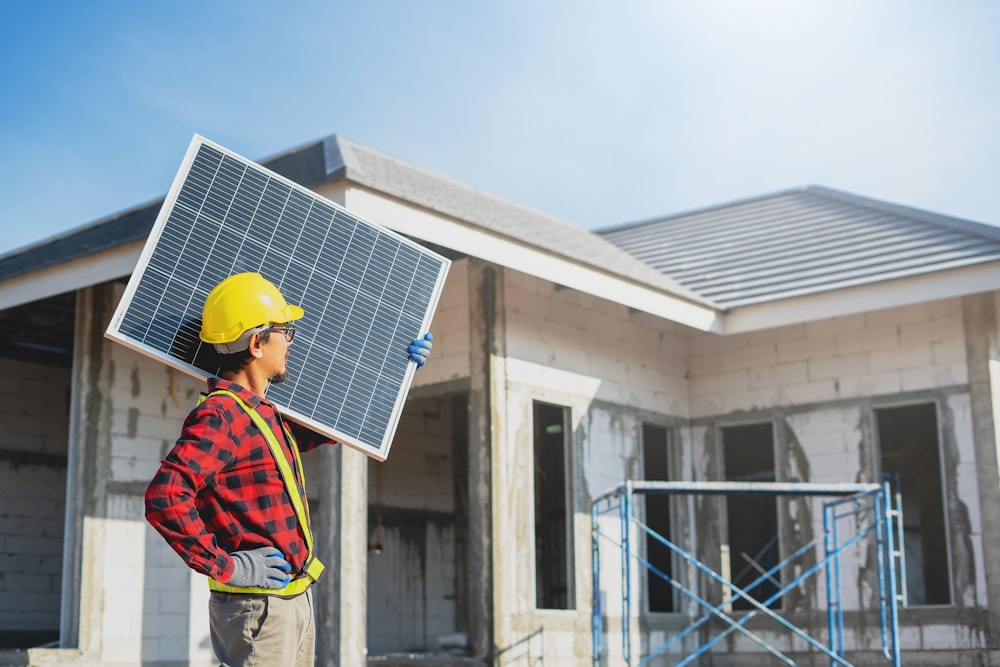 Solar expert installing panels at a customer home